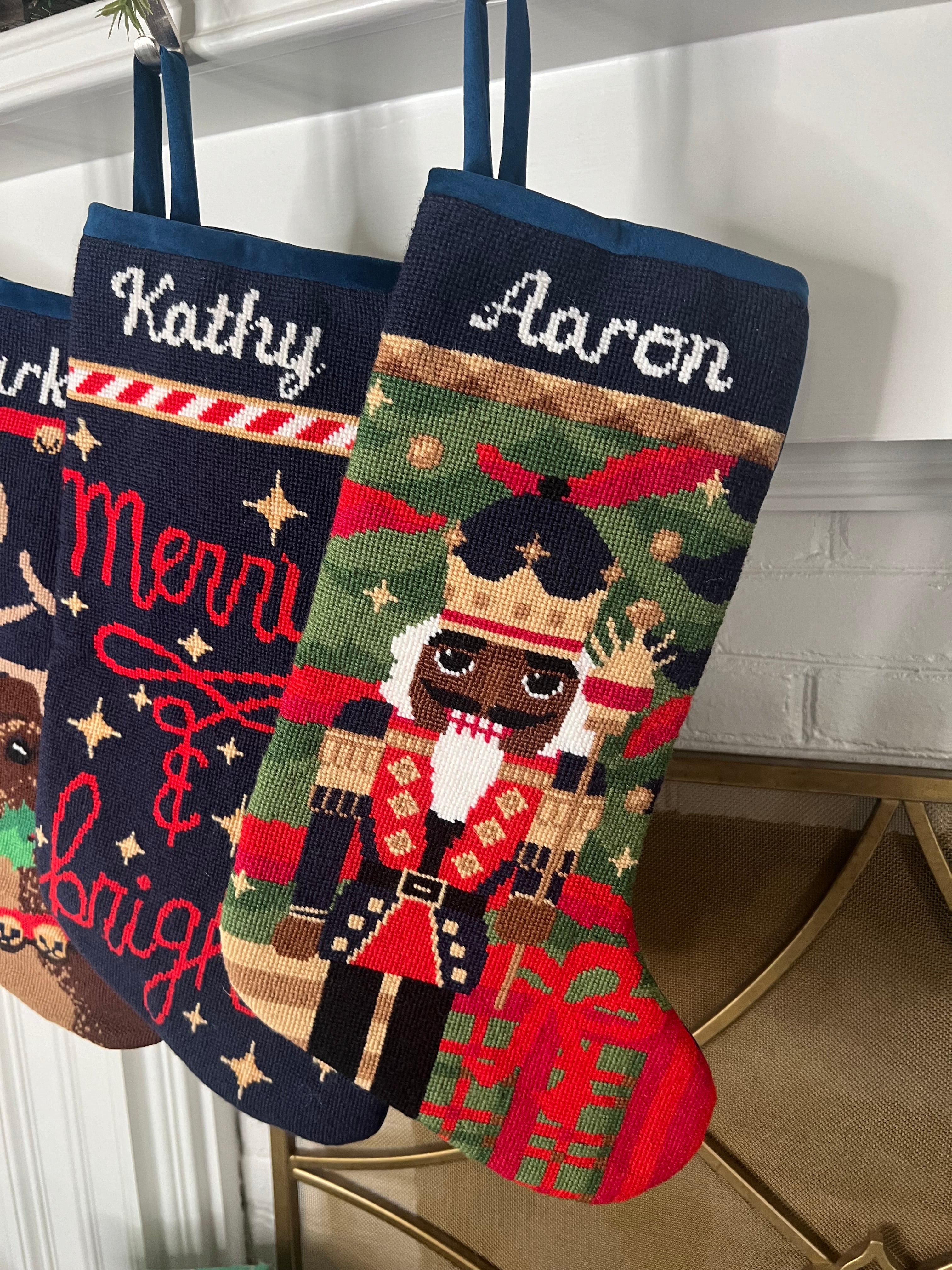 Detailed view of the Full Size Gifting Nutcracker Bauble Stockings with a monogrammed name in script