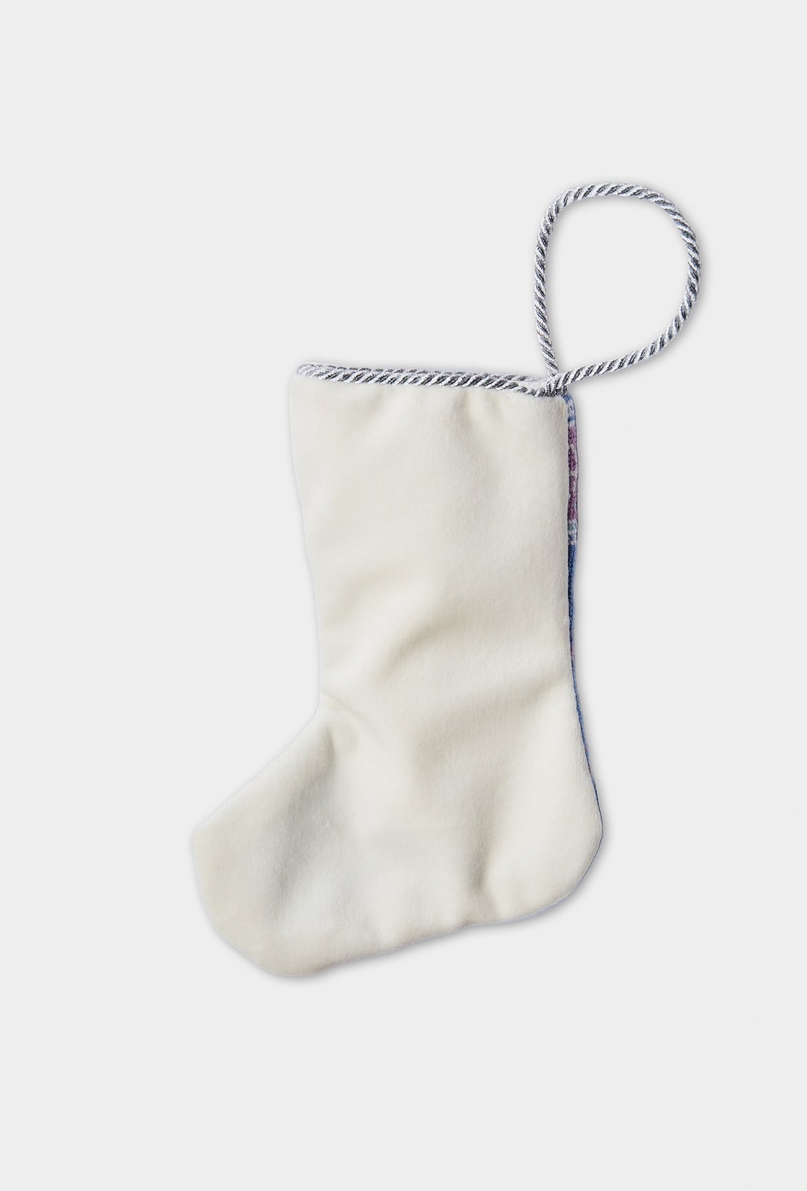 Back view of I Get My Kicks needlepoint stocking with solid white velvet backing