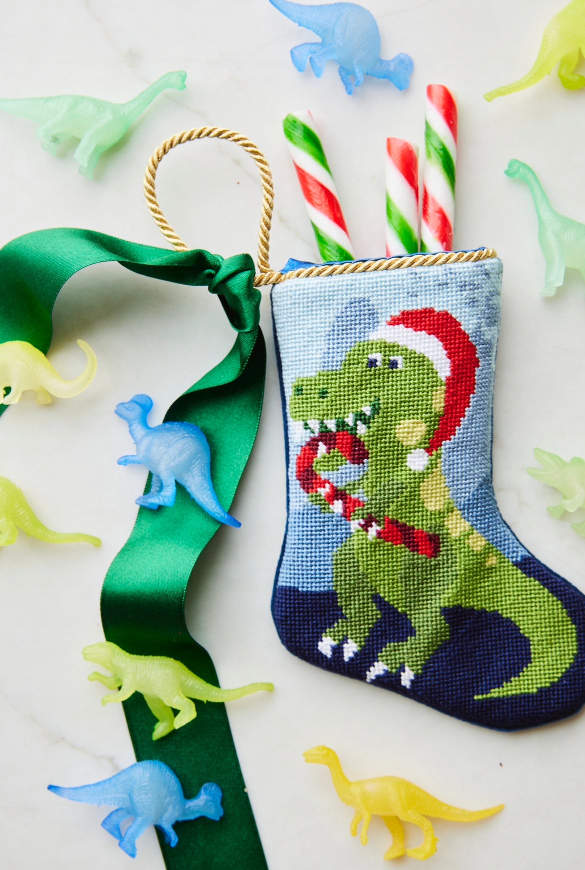 ROAR Dinosaur Bauble Stockings displayed with festive dinosaur-themed decorations