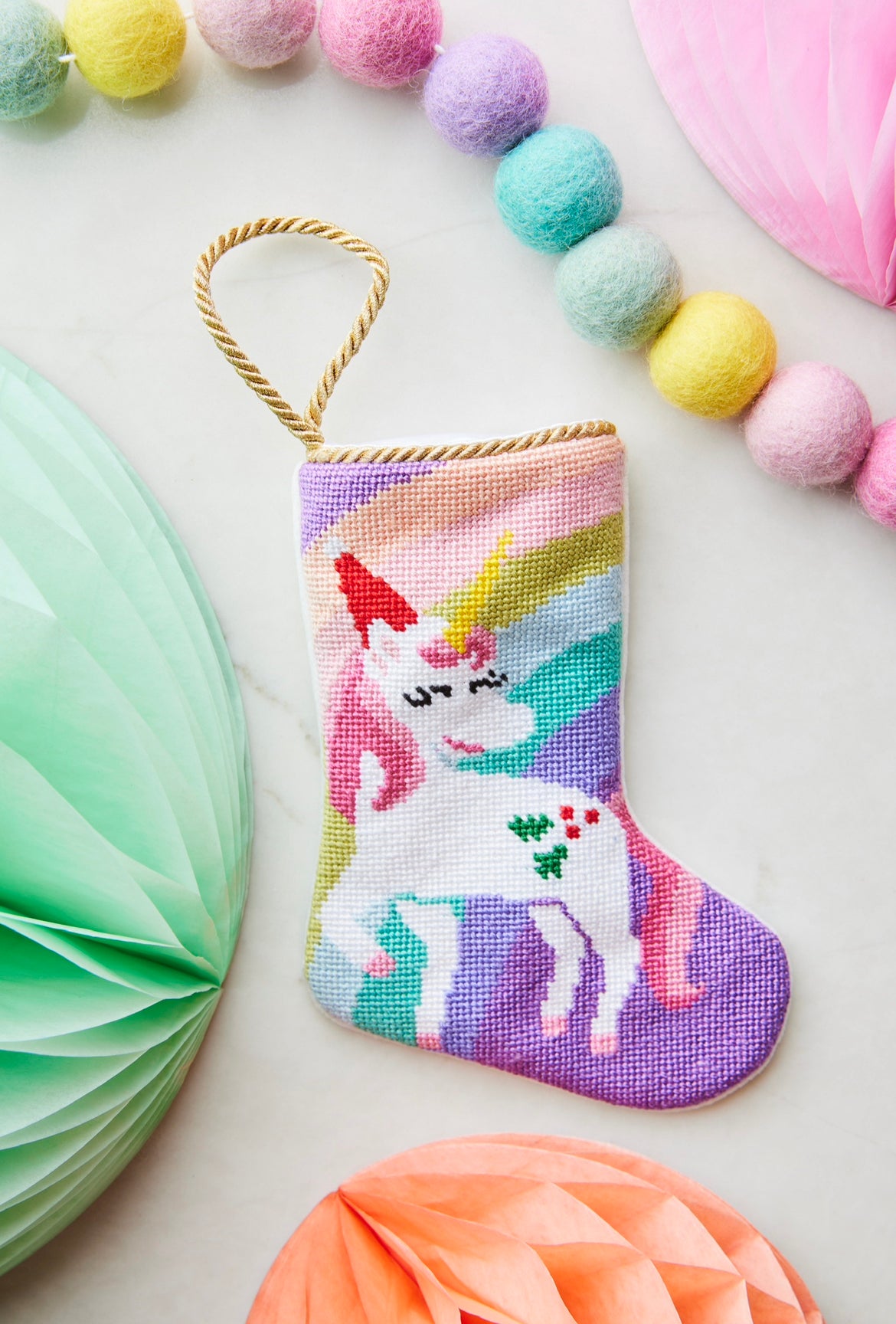 Unicorn Dreaming Bauble Stockings displayed with vibrant pastel decorations