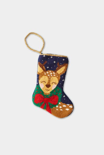 Christmas stocking featuring Dasher wearing a festive red bow and a green wreath around its neck on a navy blue backdrop with snowflakes