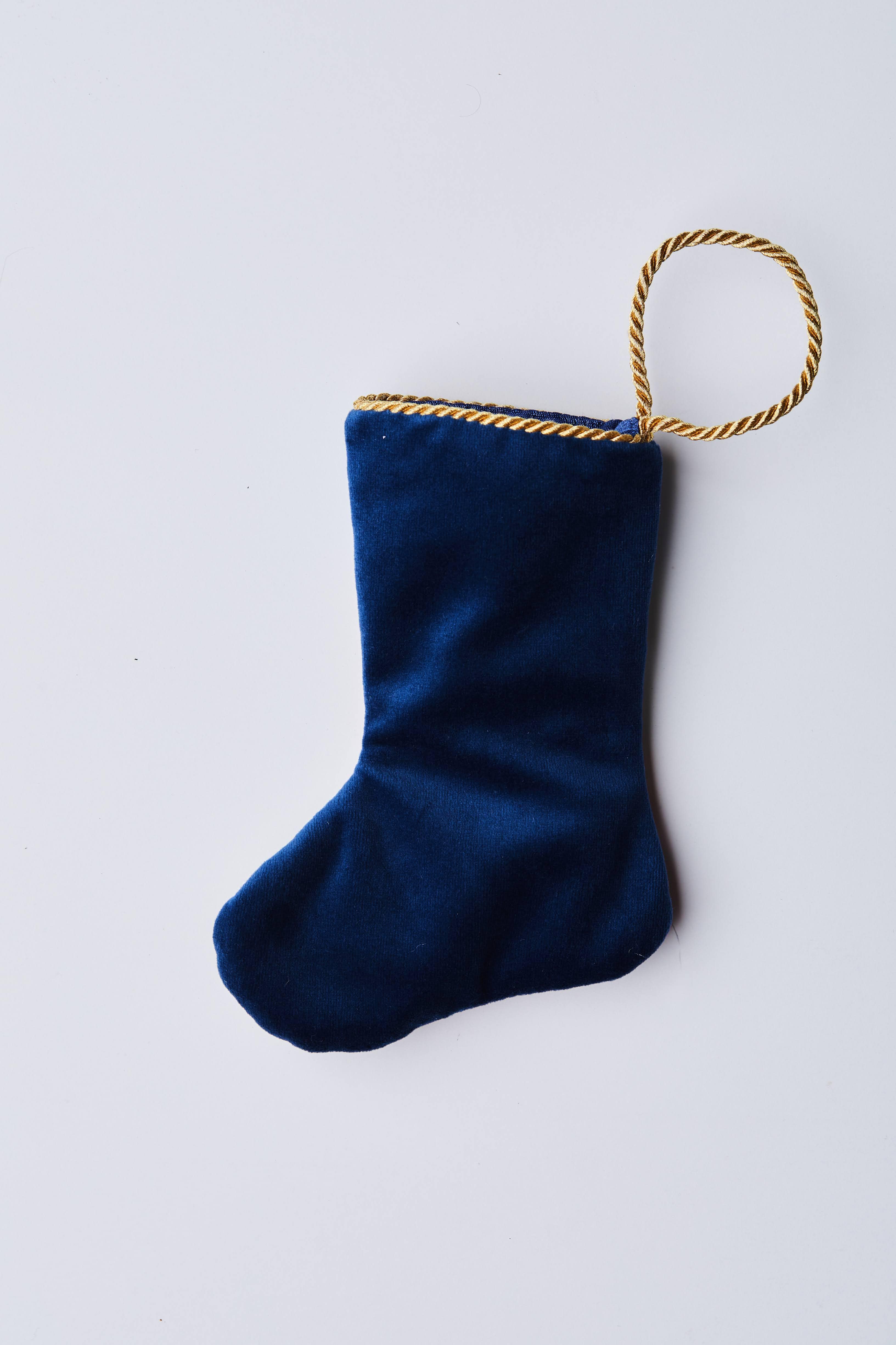 Back view of Dashing Through the Snow needlepoint stocking with solid navy velvet backing