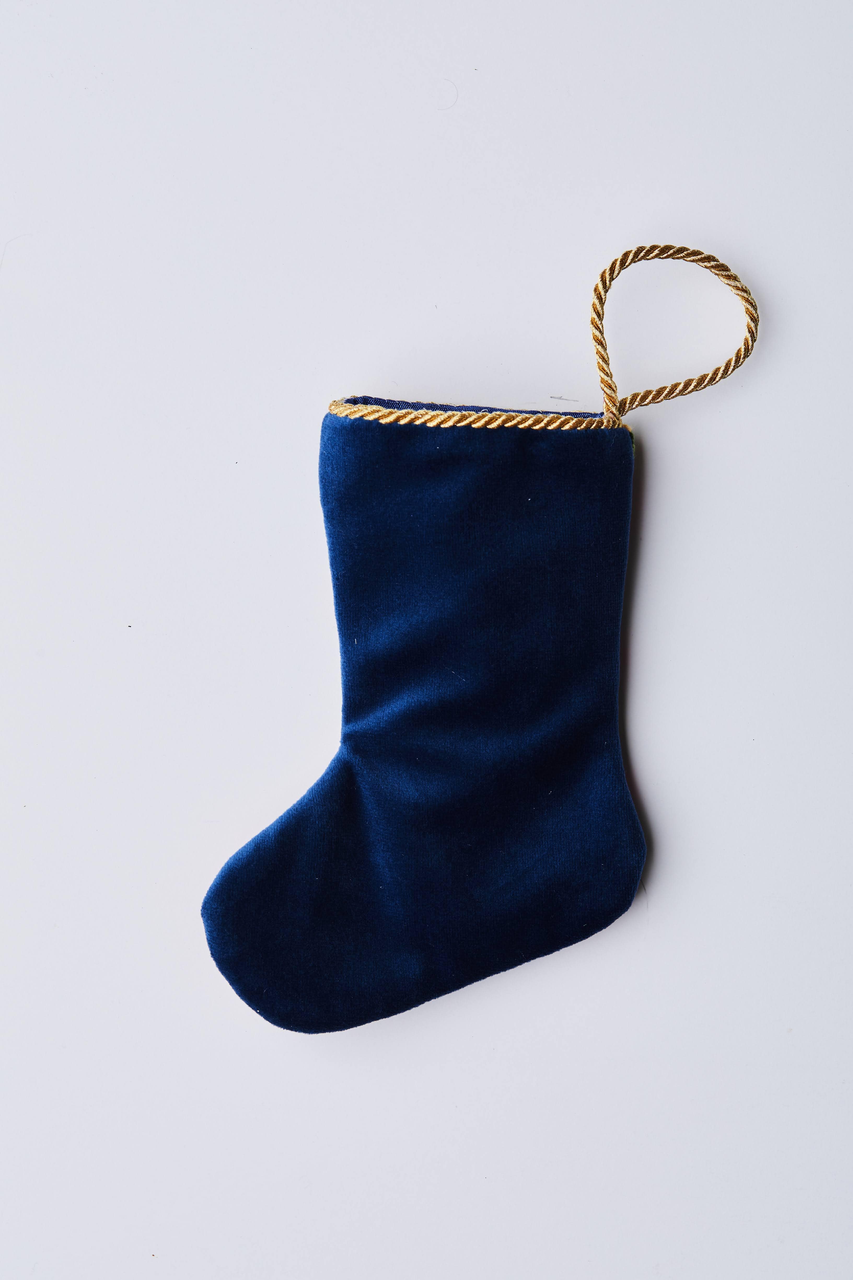 Back view of Gifting Nutcracker needlepoint stocking with solid navy blue velvet backing