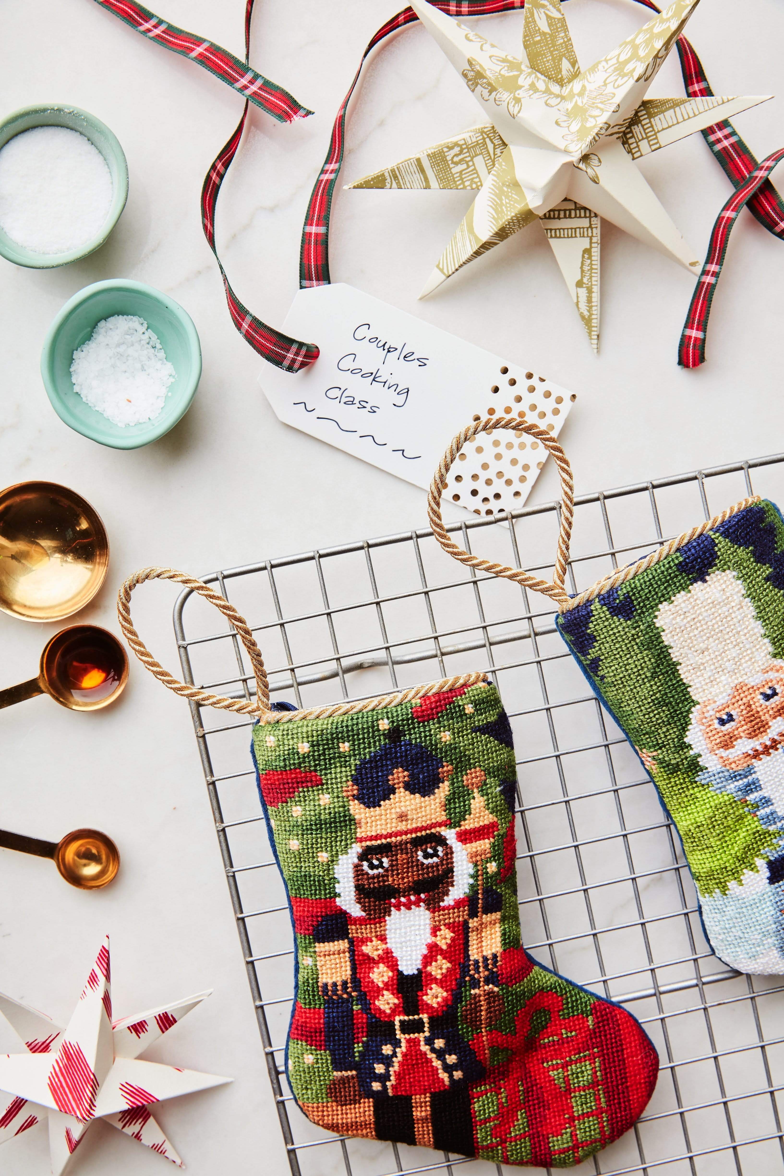 Gifting Nutcracker stocking styled with craft decor for a classic Christmas scene