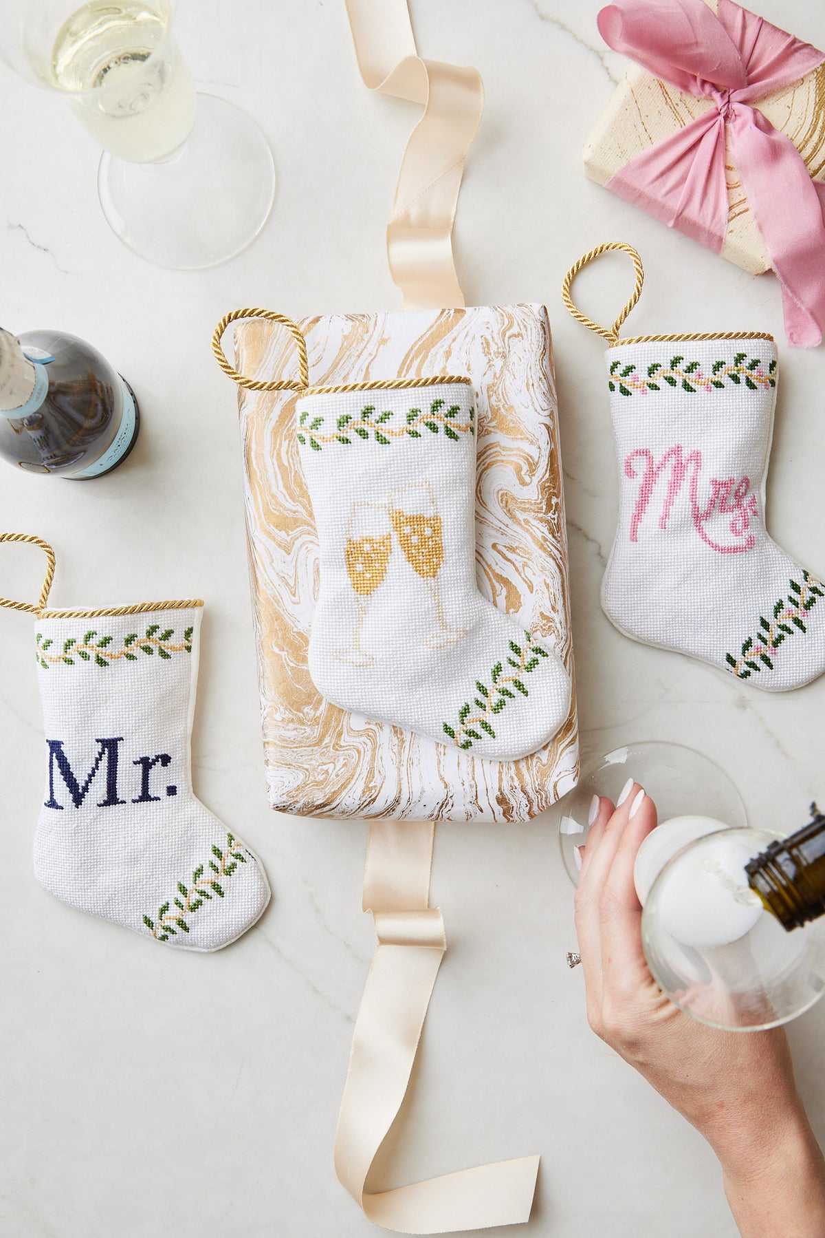 Bauble Stockings displayed alongside Mrs. and Champagne Toast stockings with festive wedding-themed accents
