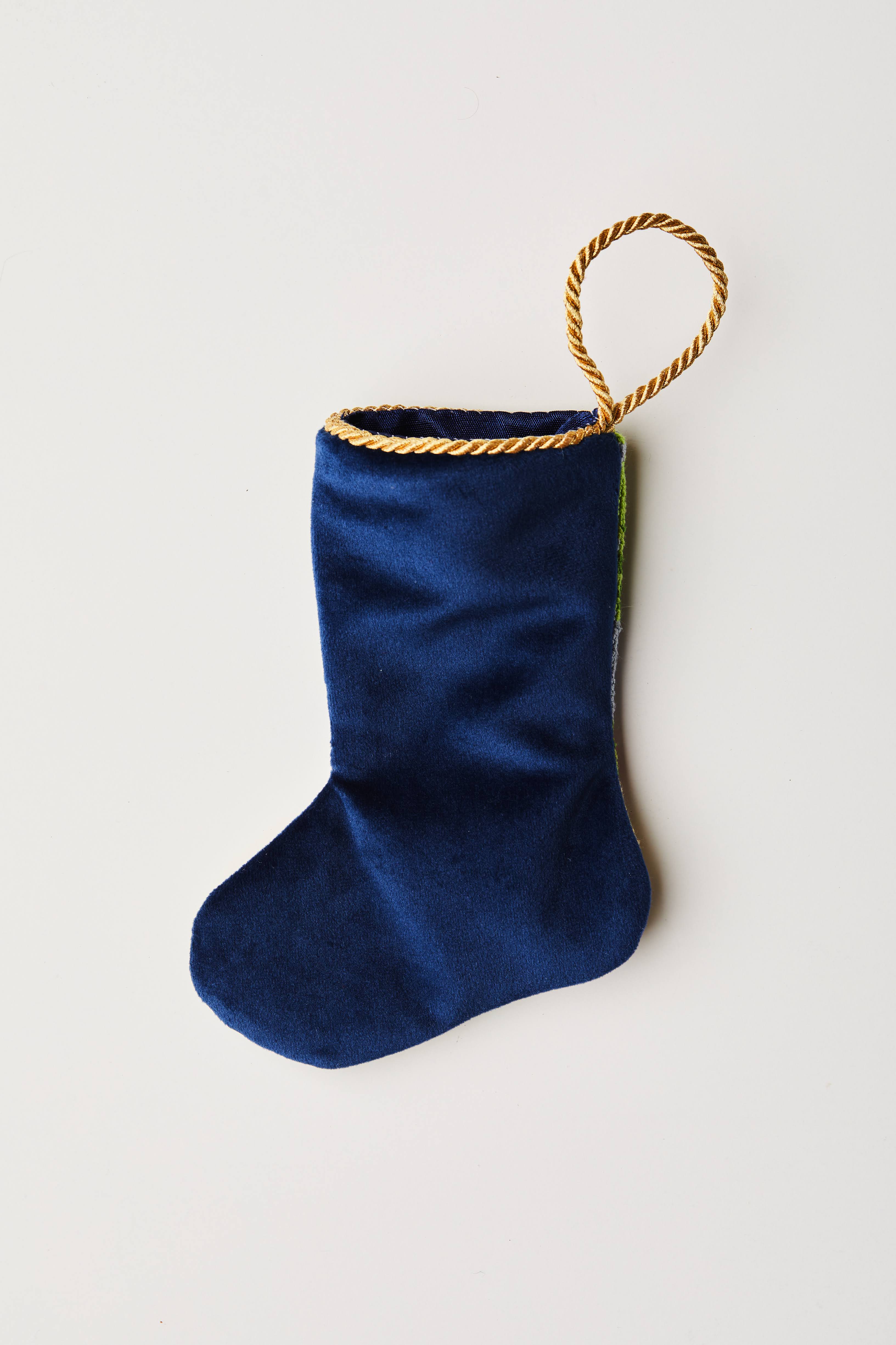 Back view of Special Delivery Santa needlepoint stocking with solid navy blue velvet backing