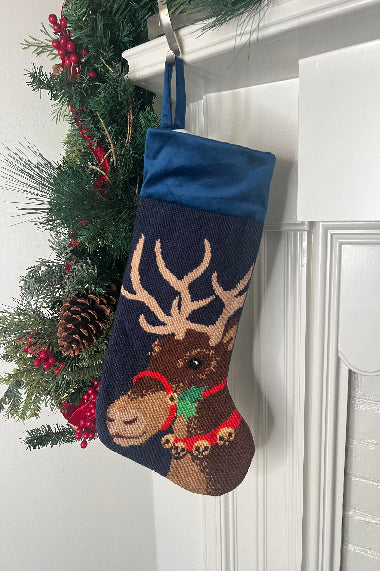 Full-size Christmas stocking featuring Donner the reindeer adorned with a red harness with jingle bells, set against a navy blue background