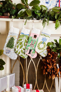 Festive mantle decorated with a Full Size Stockings, greenery, and holiday ornaments