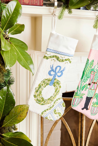 Full-size Christmas stocking featuring a festive wreath and ornaments design on white backdrop