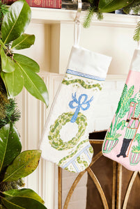 Full-size Christmas stocking featuring a festive wreath and ornaments design on white backdrop