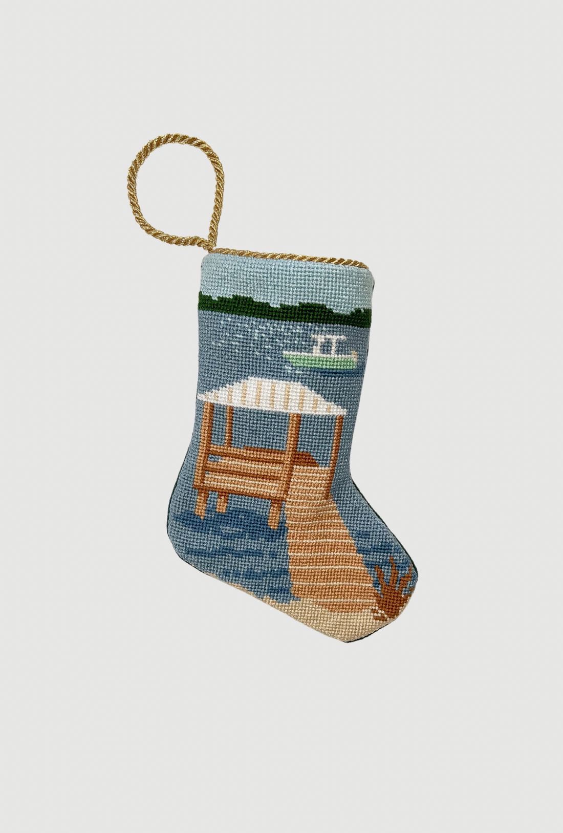 Hand-stitched Bauble Stockings featuring sailboat scene with dock and water on a coastal background