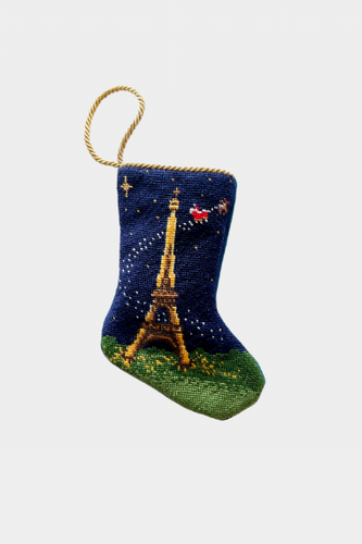 Hand-stitched needlepoint stocking featuring the Eiffel Tower with Santa flying over the Paris night sky on a navy background.