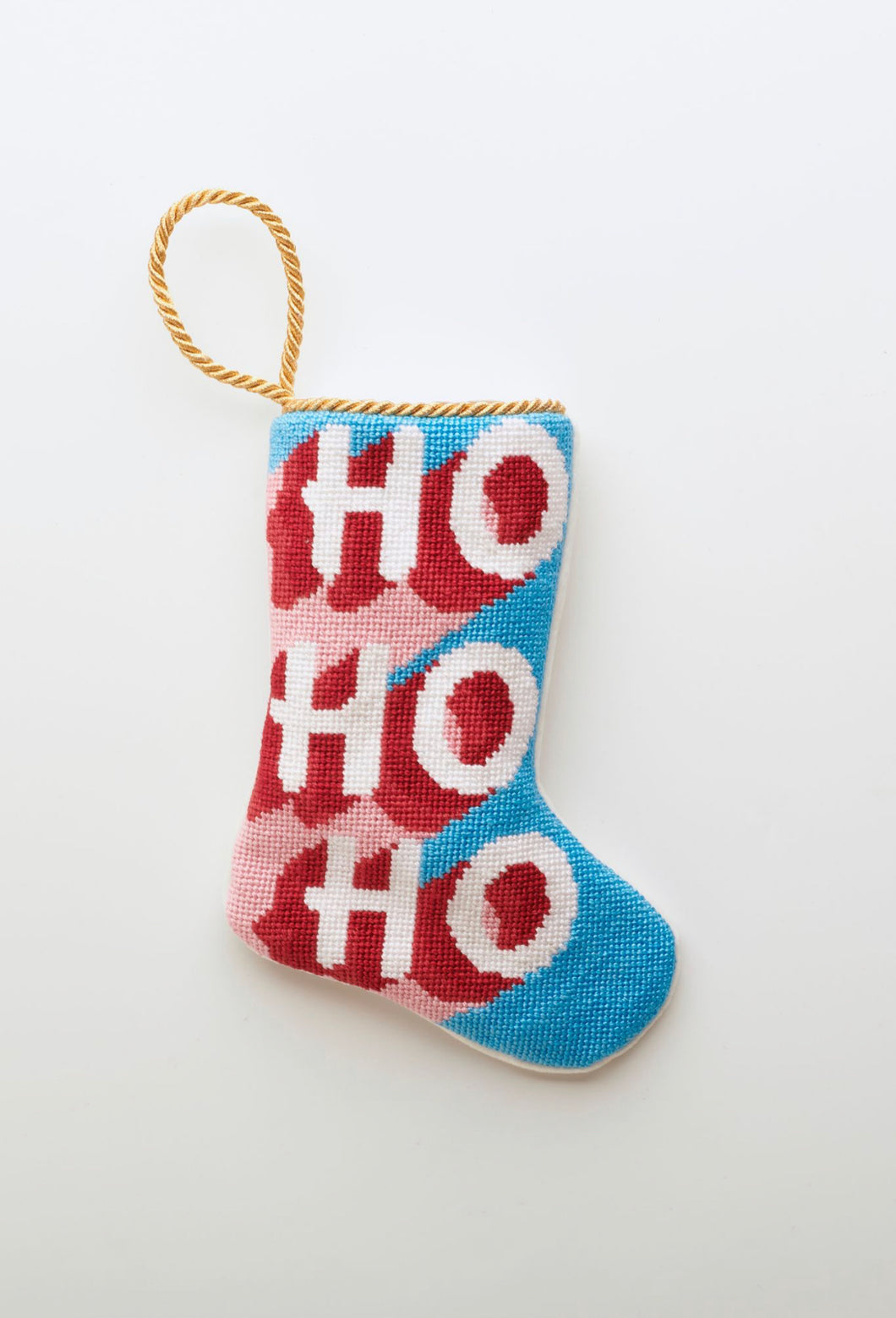 Needlepoint Bauble Stockings featuring red and white HO HO HO lettering on festive pink and blue background
