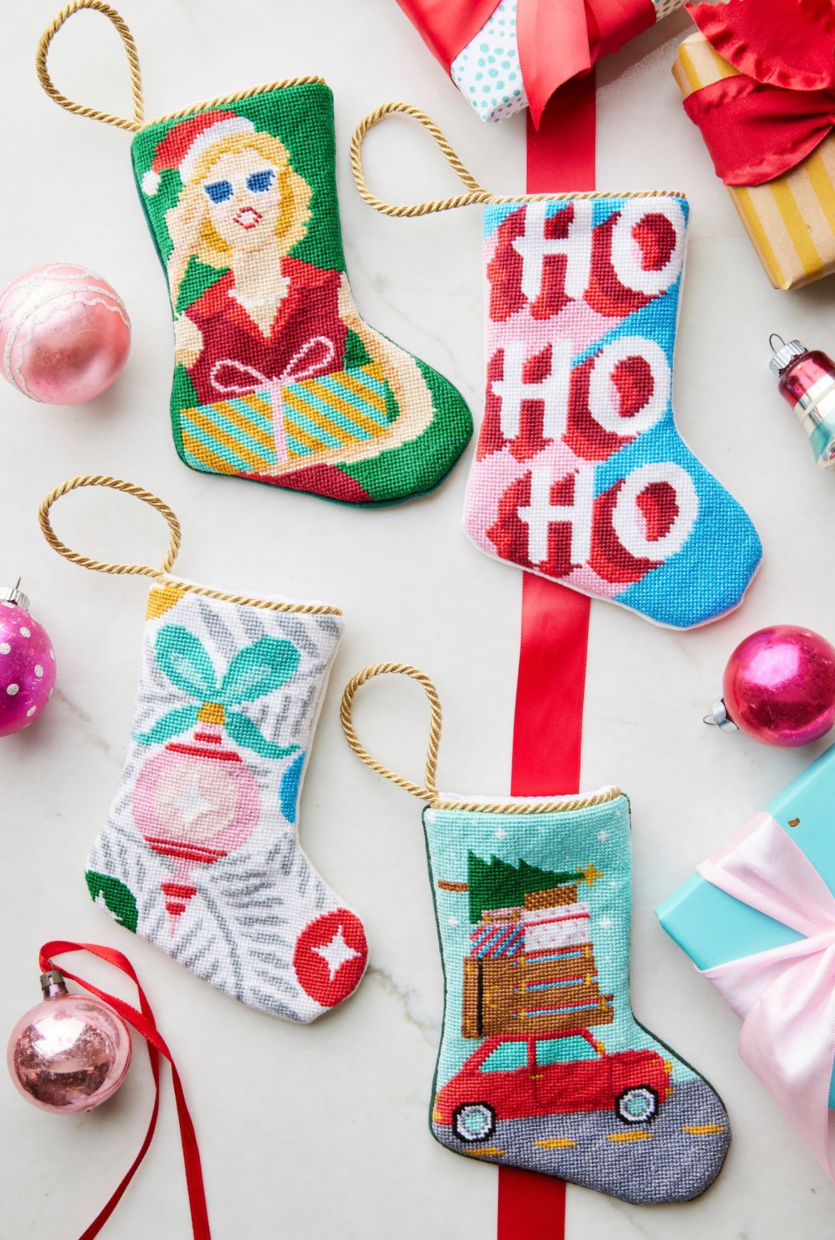 Festive display featuring Mrs. Claus Bauble Stockings, together with other holiday-themed stockings