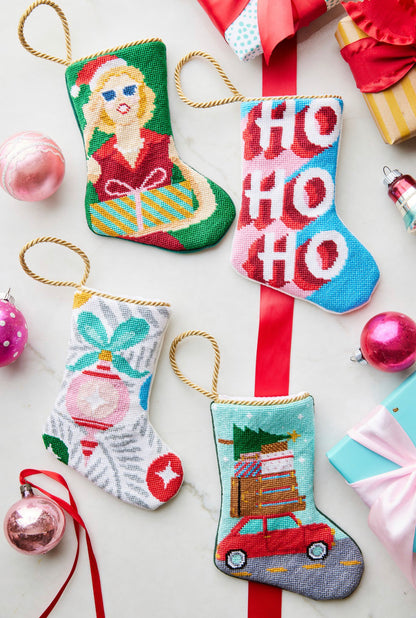 Festive display featuring Mrs. Claus Bauble Stockings, together with other holiday-themed stockings