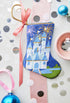 Celebration Castle Bauble Stockings surrounded by vibrant holiday-themed decor.
