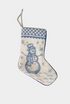 Needlepoint stocking featuring a blue snowman surrounded by falling snowflakes with decorative border