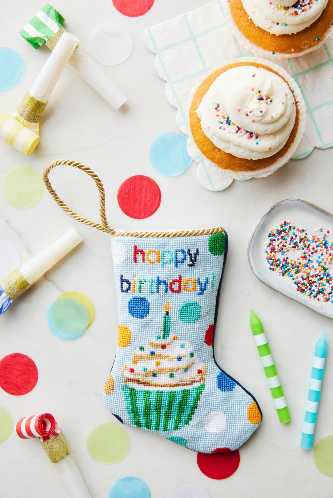 Bauble Stockings displayed with colorful confetti, birthday-themed decorations and cupcakes