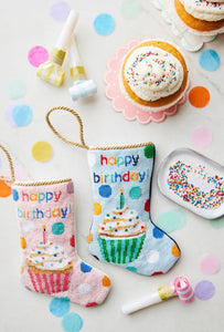 Hand-stitched Bauble Stockings set against festive birthday decorations