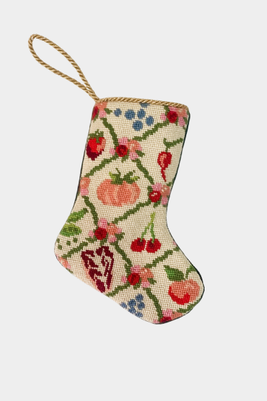 Needlepoint stocking featuring a festive arrangement of vegetables, fruits, and florals.