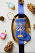 Light the Menorah Bauble Stockings displayed with Hanukkiah-themed decorations.