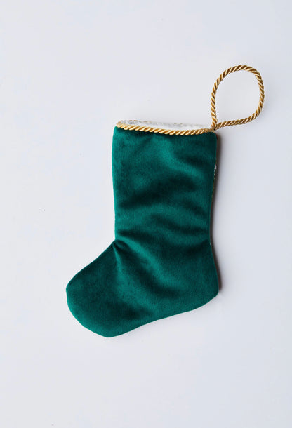 Back view of Tennis Nutcracker needlepoint stocking with solid green velvet backing