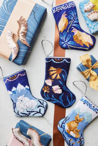 Festive display featuring Quintessential Quail Bauble Stockings, together with other holiday-themed stockings