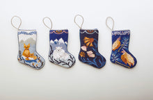 Multiple Holiday-themed Bauble Stockings displayed on white setting