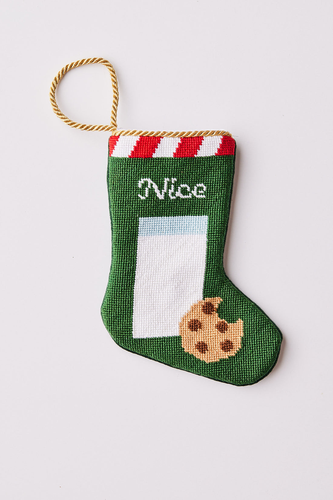 Needlepoint Bauble Stockings featuring a cookie and glass of milk on a green background with striped top