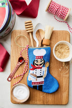Nutcracker chef Bauble Stockings styled with kitchen-themed set up