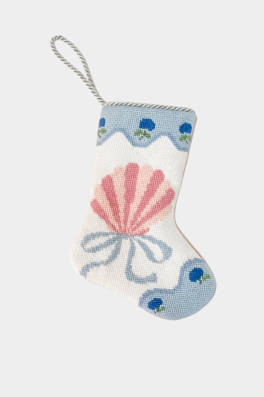 Needlepoint stocking with hand-stitched pink shell bordered with floral sea-inspired trim