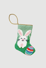 Needlepoint Bauble Stockings featuring Easter bunny and colorful Easter egg on spring green backdrop