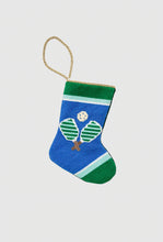 Hand-stitched needlepoint stocking featuring pickleball paddles and ball on blue background