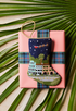Bauble Stockings styled on pink gift box with green palm leaves