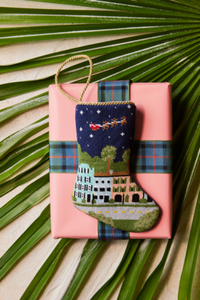Bauble Stockings styled on pink gift box with green palm leaves