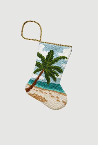 Hand-stitched Bauble Stockings featuring palm tree, sandy beach, and blue ocean in the background