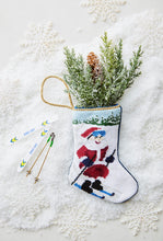 Christmas Bauble Stockings displayed with holiday greenery on a winter-themed setting
