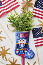 Hand-stitched Bauble Stockings displayed alongside American flag and holiday-themed decor