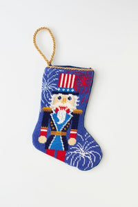 Hand-stitched needlepoint stocking with red, white, and blue colors, featuring a patriotic Nutcracker design