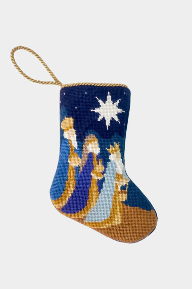 Hand-stitched stocking featuring the Three Wisemen following the Star of Bethlehem on a navy blue sky with golden and blue robes and a desert ground