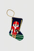 Hand-stitched stocking featuring football nutcracker in red uniform on green field background