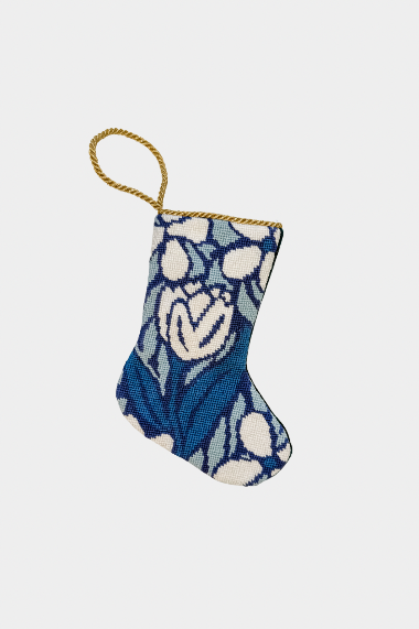 Needlepoint stocking featuring a white tulip with blue blossoms on a floral background