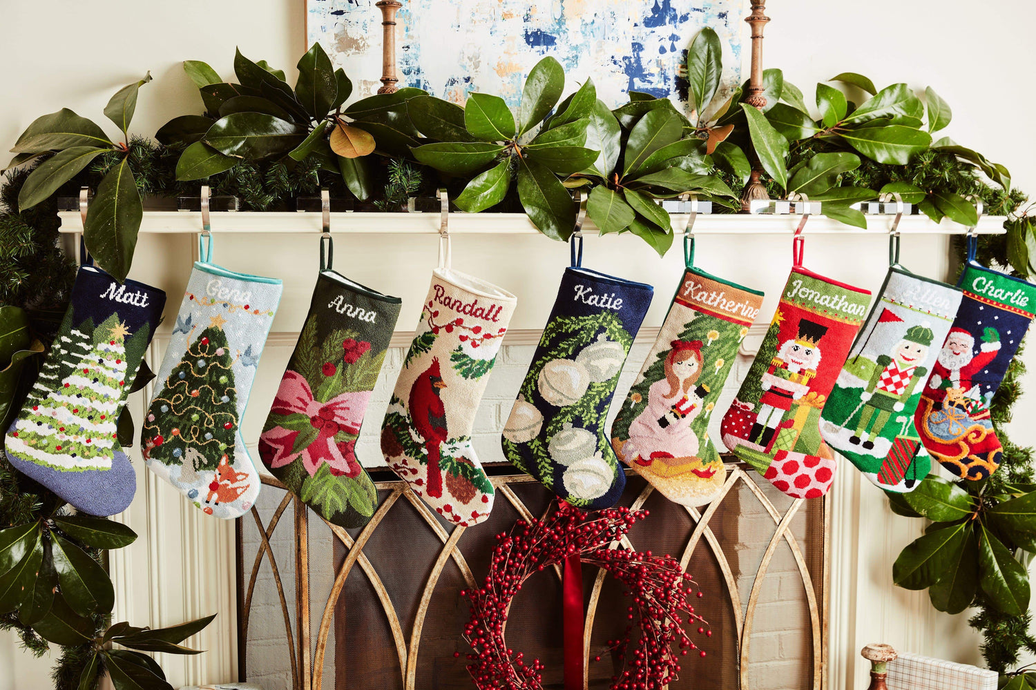 Festive mantle decorated with a Full Size Stockings, greenery, and holiday ornaments
