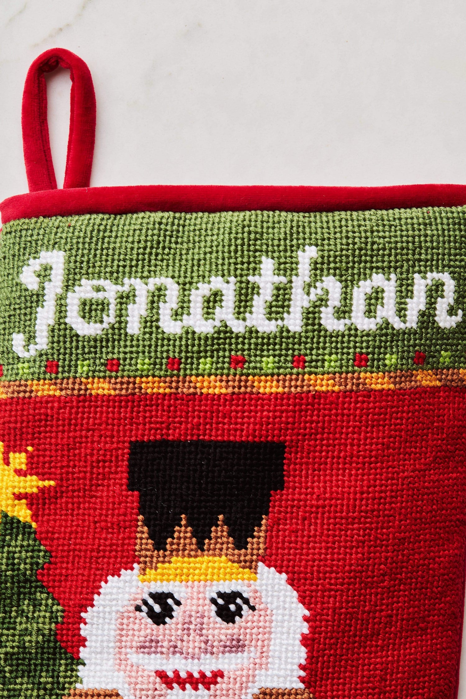Close-up view of the Full Size Bauble Stockings with a monogrammed name in script 