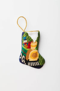 All Aboard needlepoint stocking with colorful toy train on green and navy background