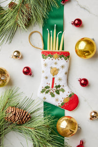 Bauble Stockings displayed with holiday-themed decorations, pine sprigs, and festive ornaments