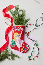 Bauble Stockings displayed with holiday-themed decorations and festive accents