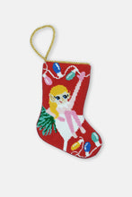 Hand-stitched stocking featuring a cocktail-loving elf with a martini glass on a red background