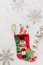 Bauble Stockings styled with snowflakes and nutcracker