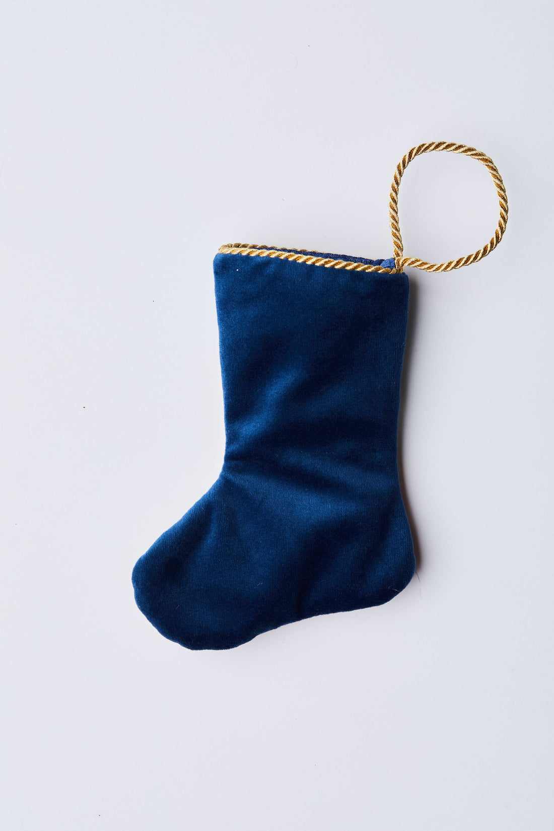 Back view of Dashing Through the Snow needlepoint stocking with solid navy velvet backing